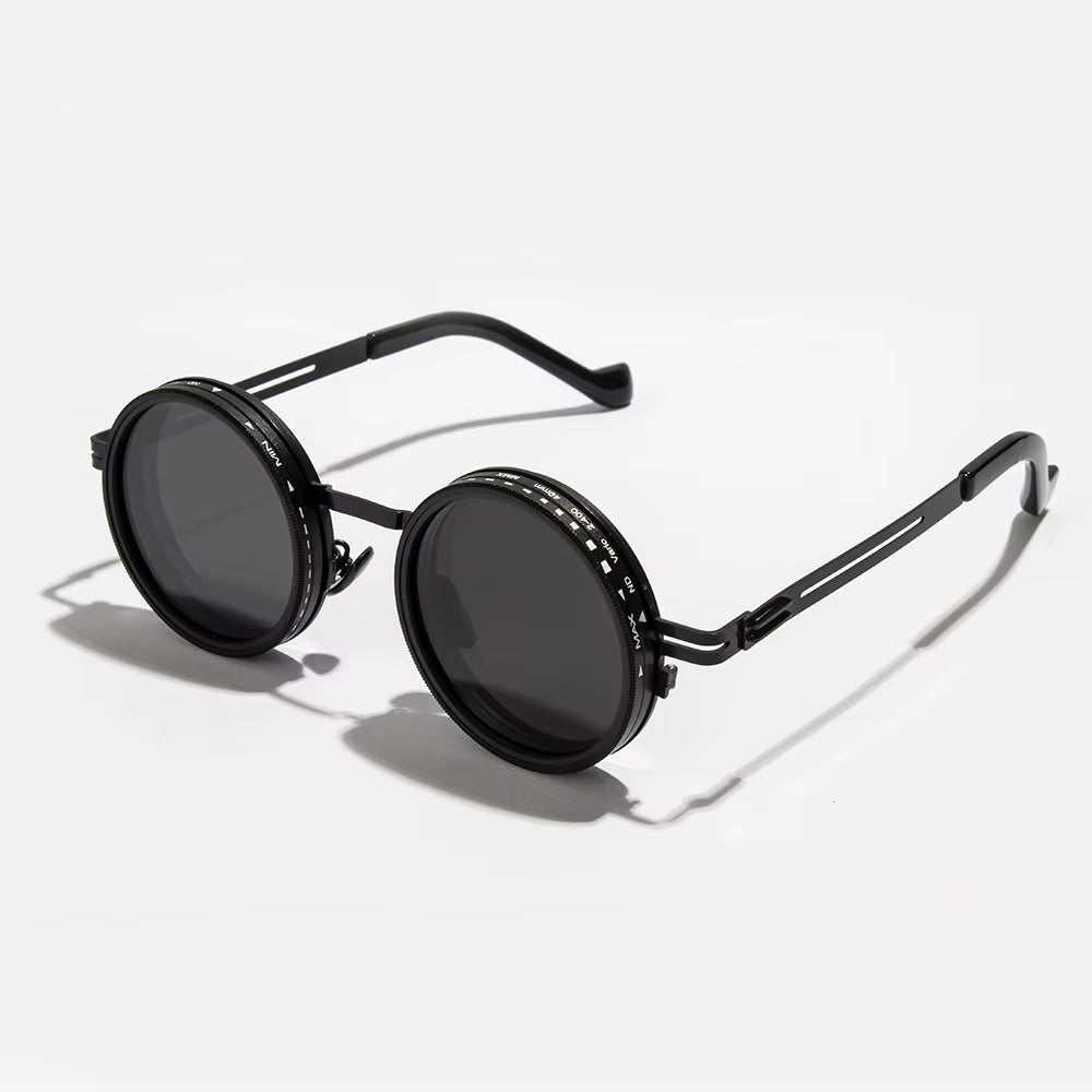 Round black sunglasses with metallic frame on a white background